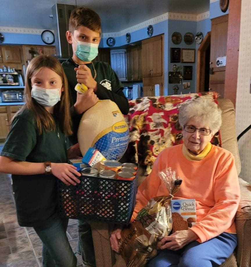 Andrew and Cora, with their great-grandmother, Judy Muller. Every year, Tri-Gal 4-H gives a Thanksgiving basket to someone in the community.